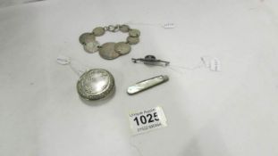 A mixed lot of silver including pill box, coin bracelet, brooch etc