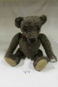A vintage jointed teddy bear