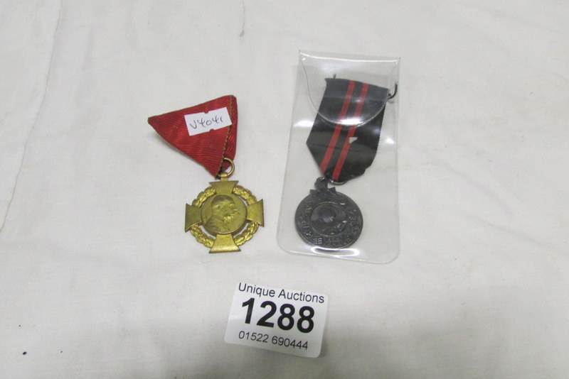 A 1848-1908 German Diamond Jubilee Civil List medal and a German WWII Finnish Campaign