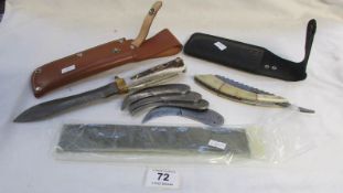 A Damascus steel knife, a cut throat razor, skinning blades etc