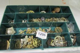 A boxed of mixed military cap badges including some copies?