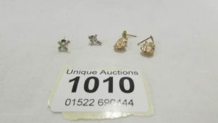 A pair of 9ct gold cross earrings together with a pair of 9ct gold cat earrings