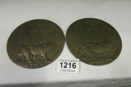 2 WW1 memorial plaques, one dedicated to Ernest William Isaacs, the other badly worn