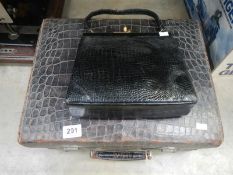 A ladies vanity case a/f and a hand bag