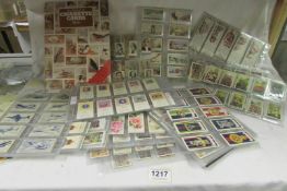 A quantity of cigarette cards (some rare) and some tea cards