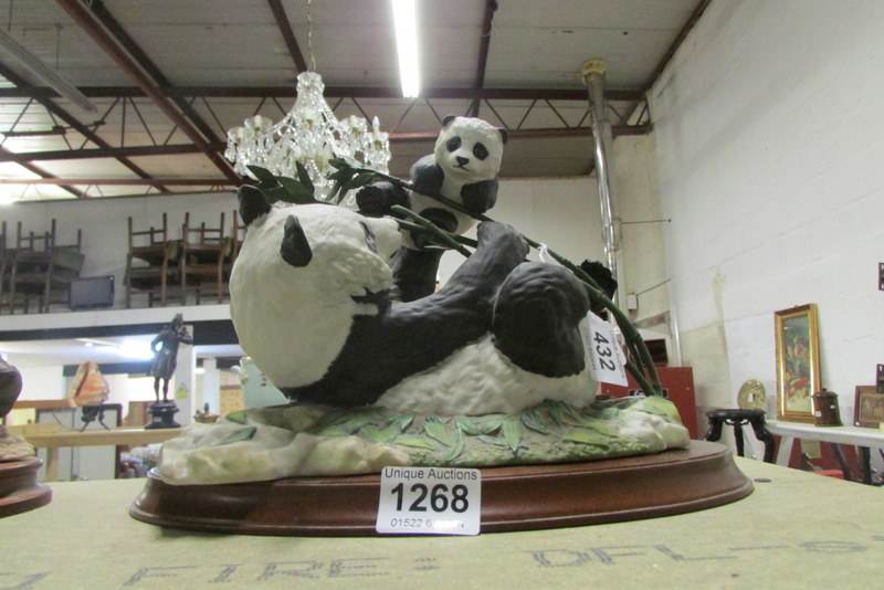 A Franklin Mint panda group entitled 'Pride and Joy'