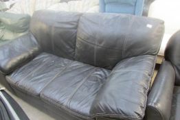 A dark brown leather sofa