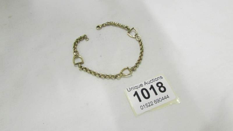 A 14ct gold horse stirrup bracelet