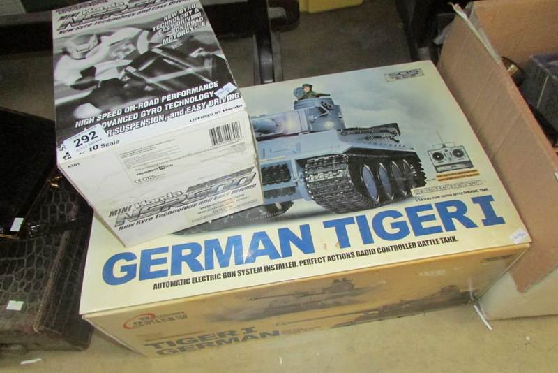 A remote controlled Heng Long German Tiger 1 tank and a TAIYO Honda NSR500 motorcycle