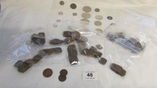 A quantity of old coins including Malayan 1 cent pieces