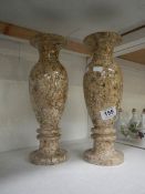 A pair of stone vases