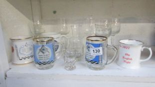 A collection of Masonic mugs and glasses