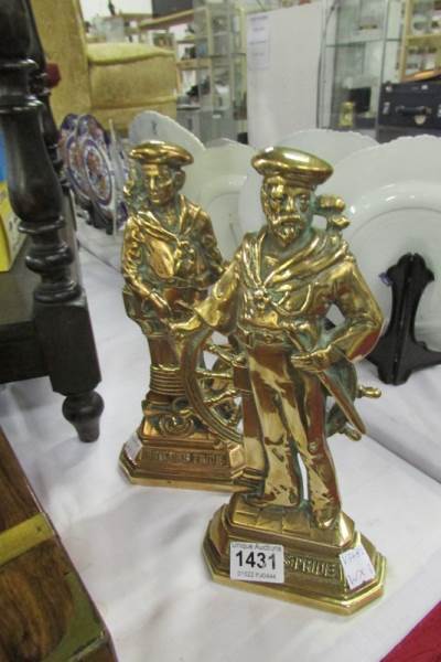 A pair of brass 'Britain's Pride' doorstops