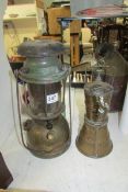 A brass coal salt & tanning Grimsby hand lamp and a B1 Aladdin 300x brass pressure lantern