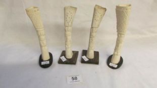 4 carved bone spill vases (possibly Pacific islands)