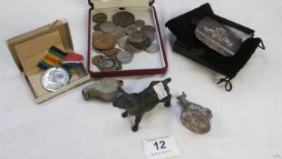 A mixed lot including coins, whistle etc