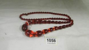 A 20th century red amber necklace