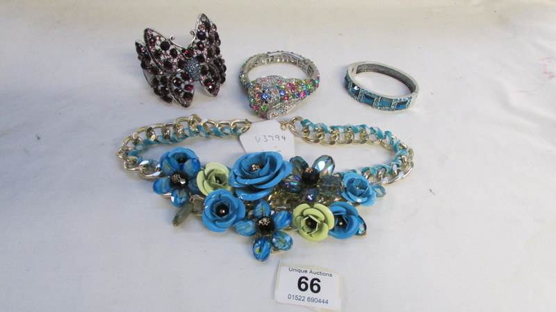 3 stone encrusted bracelets and a necklace