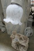 A pair of new table lamps depicting lovers on a bench