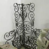 A pair of wrought iron panels