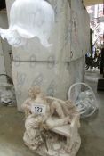 A pair of new table lamps depicting lovers on a bench