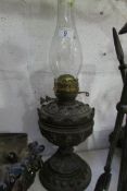 A Victorian oil lamp with chimney