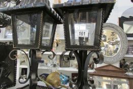 A pair of wall mounting lanterns