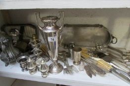 A mixed lot of silver plate, one shelf