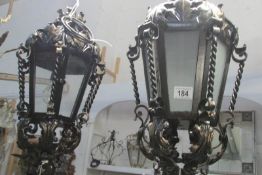 A pair of exterior wall lights with brackets