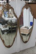 A pair of gilt framed mirrors
