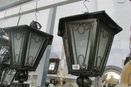 A pair of large wall lights with brackets