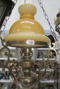 A brass hanging lamp