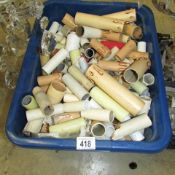 A box of assorted candle tubes