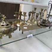 A mixed lot of brassware (one shelf)
