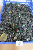 A large tray of coloured glass buttons