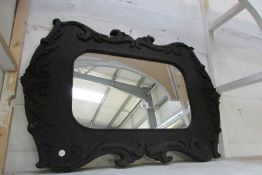 A large wood framed mirror