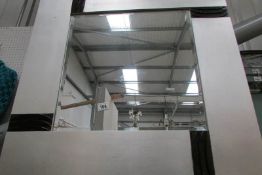 A bevel edged mirror in silvered frame