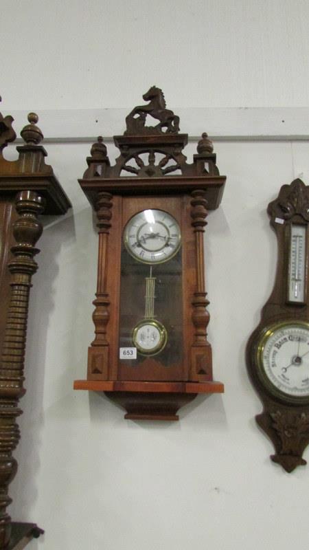 A mahogany Vienna wall clock