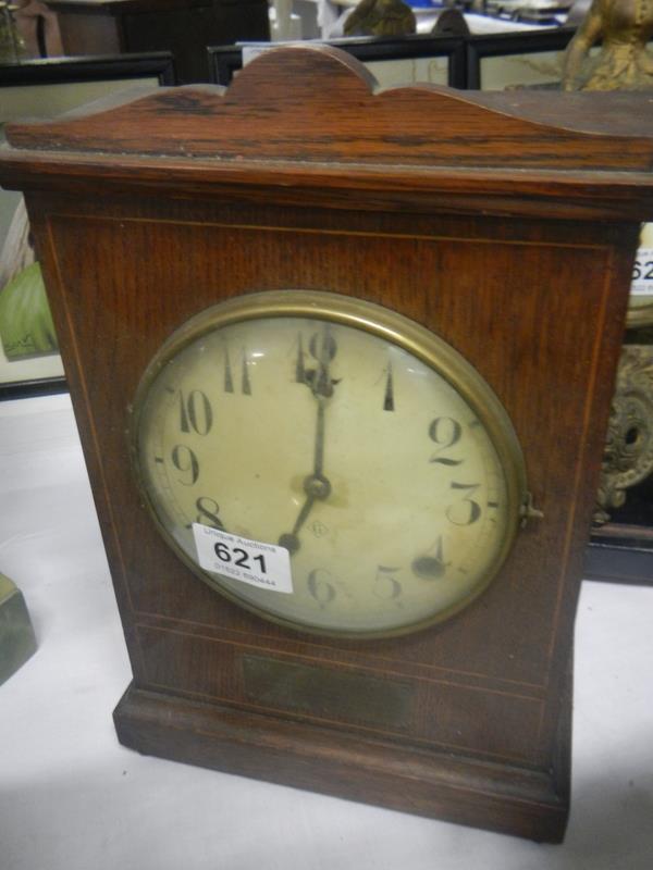 A mahogany inlaid clock