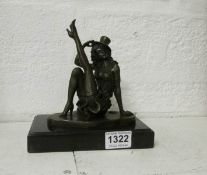 A bronze of a female dancer with top hat