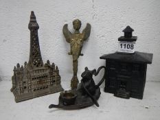 A bank house money box, Blackpool tower ornament, mouse on leaf candlestand and angel figure