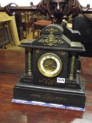 A black mantel clock