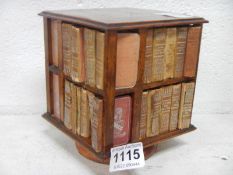 A miniature revolving bookcase with miniature works of William Shakespeare