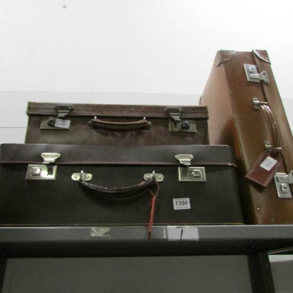 3 vintage suitcases