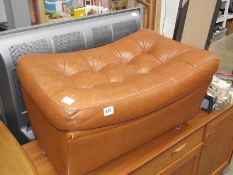 A tan leather stool