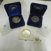 2 QE2 silver medallions and a silver dollar