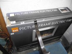 A boxed B & Q picture frame electric fire