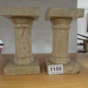 A pair of heavy marble plinths