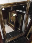 A gilt framed mirror