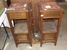 A pair of inlaid stands with marble tops